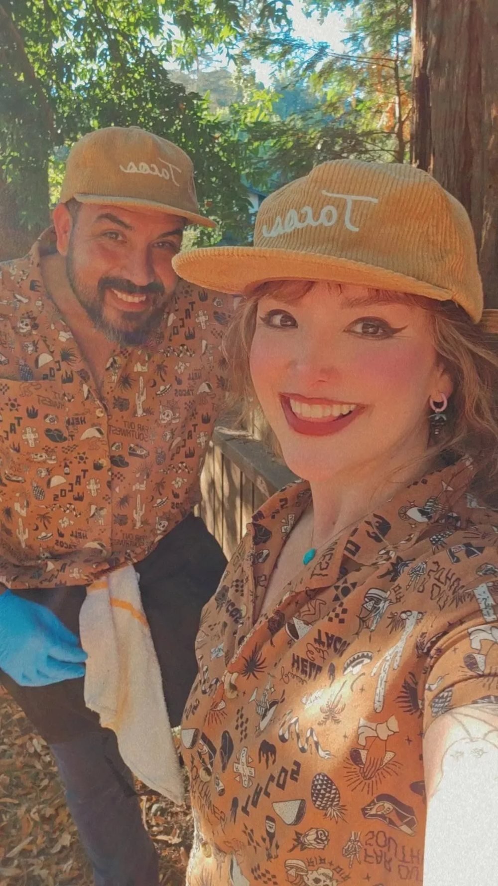 Emmanuel and his wife, the Taco Man team, in their caps and taco-print shirts